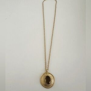 Vintage Emmons gold tone textured faceted brown crystal pendant.